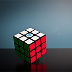 A puzzle cube on a table
