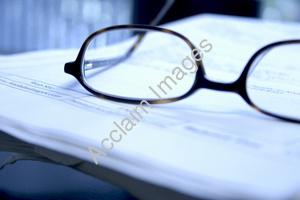 eyeglasses resting on a document